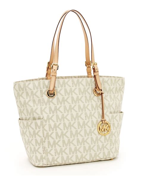 michael kors mk logo jet set travel tote vanilla|michael kors bag with airplanes.